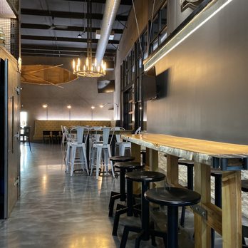 Rush Creek Distilling - a long bar with stools - Bars Near Me - Harvard, Illinois