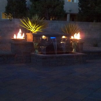 WaterQuest Landscaping - a fountain with lit torches - Landscaping Near Me - Albuquerque, New Mexico