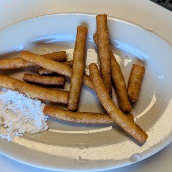 State Line Restaurant - Home-made funnel cake sticks with powdered sugar. - Breakfast & Brunch Near Me - Greendale, Indiana State Line Restaurant - Home-made funnel cake sticks with powdered sugar. - Breakfast & Brunch Near Me - Greendale, Indiana