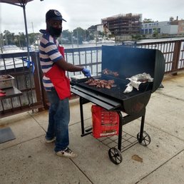 Mr Fitzroy serving up some of the best jerk chicken,fish and corn on the cob on this side of town.