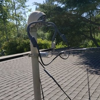 Green's Property Inspections - The electrical service mast wires are going through a tree. This is a dangerous situation. Do you need a home inspection? Call today - Home Inspectors Near Me Green's Property Inspections - The electrical service mast wires are going through a tree. This is a dangerous situation. Do you need a home inspection? Call today - Home Inspectors Near Me