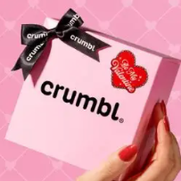 Pink box holding a cookie with a red heart sticker in the right hand corner and a brown ribbon tied Bow in the left corner Pink box holding a cookie with a red heart sticker in the right hand corner and a brown ribbon tied Bow in the left corner