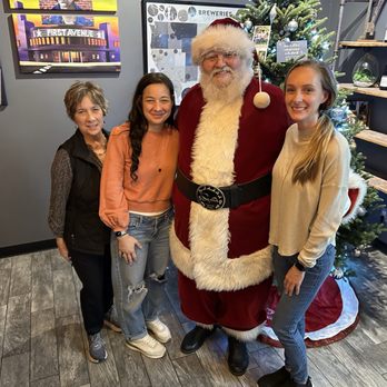 Spider Monkey's Bake Shoppe - santa claus posing with a group of women - Bakeries Near Me - Farmington, Minnesota