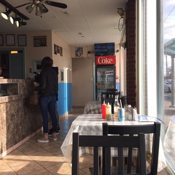 Restaurante Las San Sivar Pupusería - a woman standing at the counter - Salvadoran Near Me - Toronto, Ontario Restaurante Las San Sivar Pupusería - a woman standing at the counter - Salvadoran Near Me - Toronto, Ontario