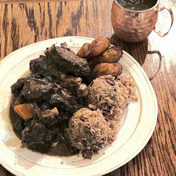 Coconuts Caribbean Restaurant & Bar - Combo: oxtail and jerk chicken. Comes with rice/beans and plantains $24 - Caribbean Near Me - Palo Alto, California Coconuts Caribbean Restaurant & Bar - Combo: oxtail and jerk chicken. Comes with rice/beans and plantains $24 - Caribbean Near Me - Palo Alto, California
