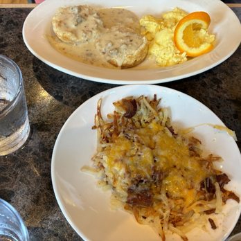Post - American Eatery - Biscuits and sausage gravy with a side of loaded hash browns. - American Near Me - Hudson, Wisconsin