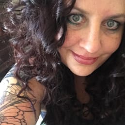 a woman with a tattoo on her arm