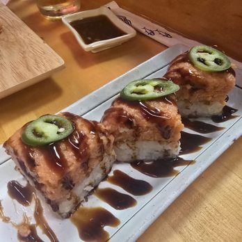 Sushi District - Crispy rice with spicy tuna. Supposed to be 4 but i already ate the other one! Look how thick it is. - Sushi Bars Near Me - Costa Mesa, California