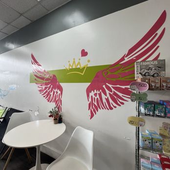 Tea Spot - Cute angel wing  photo spot on wall - Coffee & Tea Near Me - Aiea, Hawaii