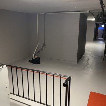 Sundahl Waterproofing - After water management system and freshly painted walls and floor - Waterproofing Near Me