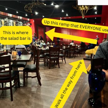 Texas de Brazil - My "hike" to the salad bar, If you are a couple you may have to prepare to sit here. Everyone along the edge on this side was a couple. - Steakhouses Near Me - Honolulu, Hawaii