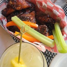Grilled wings bourbon chipotle sauce and seasonal moctail