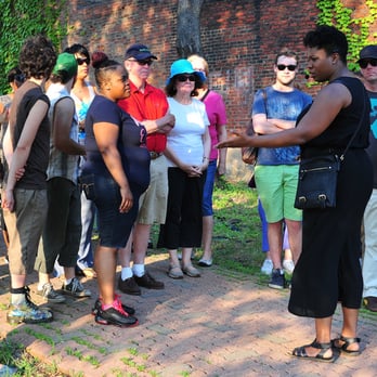 Bricolage - Performer Bria Walker leads participants in Saints Tour, a immersive, mobile experience in Braddock, Pa. - Performing Arts Near Me - Pittsburgh, Pennsylvania Bricolage - Performer Bria Walker leads participants in Saints Tour, a immersive, mobile experience in Braddock, Pa. - Performing Arts Near Me - Pittsburgh, Pennsylvania