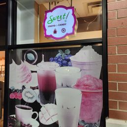a window with a sign that says sweet