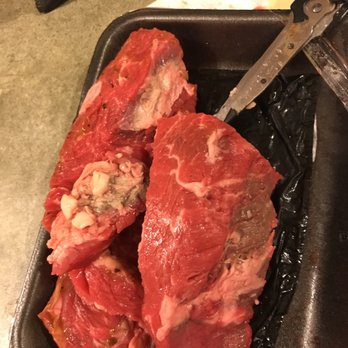 Shaw's - raw meat in a pan with a knife - Grocery Near Me - South Yarmouth, Massachusetts