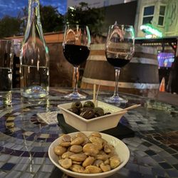 Belle Cora - Super Tuscan, Warmed Olives, and Marcona Almonds.