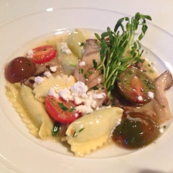 The TimberHearth - Agnolotti stuffed w English peas, ricotta w heirloom baby tomatoes, Colorado goat feta, wild mushrooms, white wine beurre fondu. - New American Near Me - Edwards, Colorado