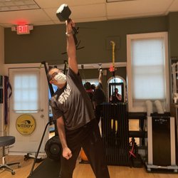 Sullivan Strength Systems - A client working on "Thor's Hammer" one arm snatch/raise