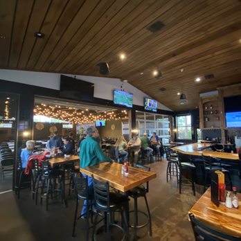 The Back Porch - The inside of the back porch is perfect for watching games on the many TVs and they have a stage with live music. - American Near Me - Kilgore, Texas The Back Porch - The inside of the back porch is perfect for watching games on the many TVs and they have a stage with live music. - American Near Me - Kilgore, Texas
