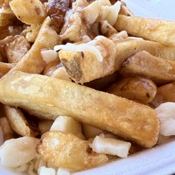 Merritville Smokehouse and Fried Chicken - Layers of curds and generous serving of fries smothered by gravy