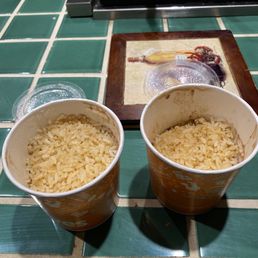 Half full large Red Beans and Rice containers opened at home. Half full large Red Beans and Rice containers opened at home.