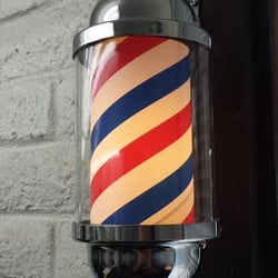 Cypress Square Barber Shop - Tiny barber pole.
