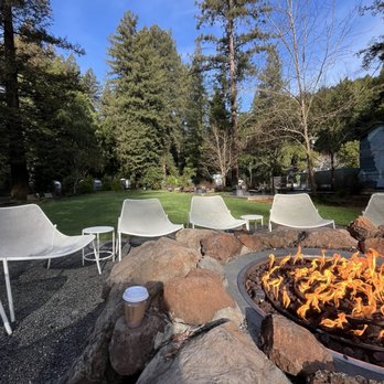 AutoCamp Russian River - Common area outdoor campfire with a cup of complementary coffee - Hotels Near Me - Guerneville, California