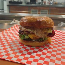 Verdict Cafe - Smash Cheeseburger with bacon, avocado, and an egg