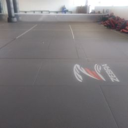 Mats sectioned off for social distancing, you can also train online.