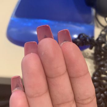 Blooming Nails Spa - Underneath shows the paint job. Those triangles are where my real nail was exposed. - Nail Salons Near Me - San Pablo, California