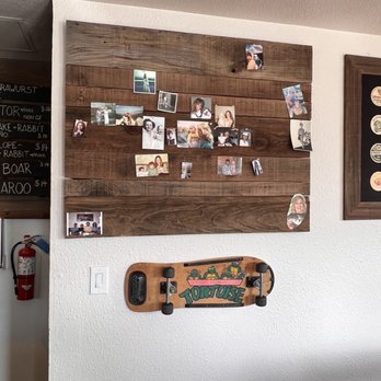Your Mom's Haus - Bulletin board and a skateboard. - Pubs Near Me - El Granada, California Your Mom's Haus - Bulletin board and a skateboard. - Pubs Near Me - El Granada, California