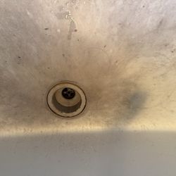 Kitchen sink. Looks like they tried to paint it?