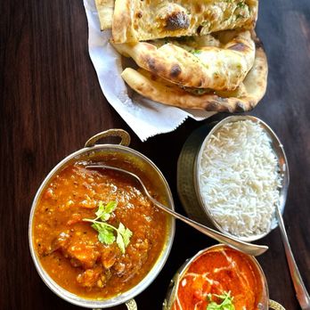 Curry Hut - Garlic naan, mango chicken curry, and chicken tikka masala served with rice. Everything was delicious - Indian Near Me - Augusta, Georgia Curry Hut - Garlic naan, mango chicken curry, and chicken tikka masala served with rice. Everything was delicious - Indian Near Me - Augusta, Georgia