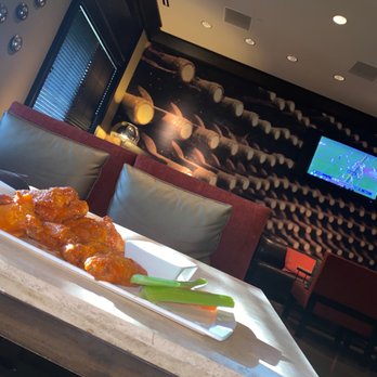 Blue Moon Lounge - a plate of chicken wings and celery - Lounges Near Me - Fort Worth, Texas
