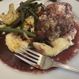 Filet minion wrapped in bacon with Gorgonzola crust. Filet minion wrapped in bacon with Gorgonzola crust.