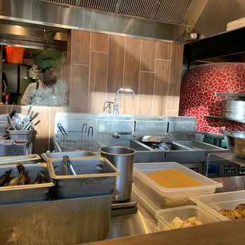 Rigo - Kitchen w/ red pizza oven - Spanish Near Me - Honolulu, Hawaii Rigo - Kitchen w/ red pizza oven - Spanish Near Me - Honolulu, Hawaii