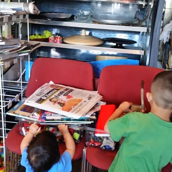 CEBU Restaurant - Magazines and toys section smack dab in the middle of the restaurant! "Yay" water jugs headed to the restroom. Sloppy! - Filipino Near Me - Olympia, Washington