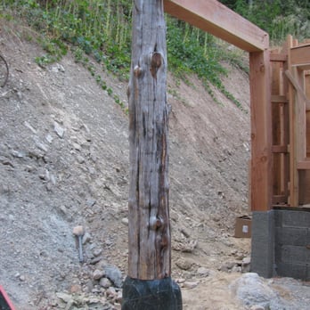 Ten Bear Builders - Natural post set on stone. This is the entrance to the house. - General Contractors Near Me Ten Bear Builders - Natural post set on stone. This is the entrance to the house. - General Contractors Near Me