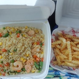Shrimp fried rice and crinkle fries.