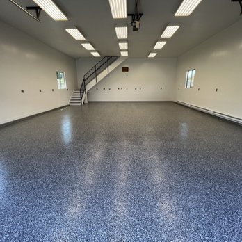 Solid Shield Floors - an empty room with a staircase - Flooring Near Me