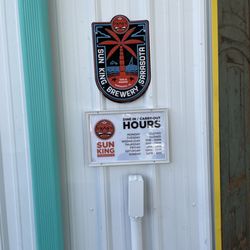 Sun King Sarasota - Hours posted by the front door