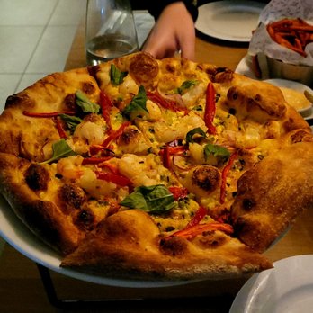 Earls Kitchen + Bar - a pizza on a plate - Canadian (New) Near Me - Burnaby, British Columbia Earls Kitchen + Bar - a pizza on a plate - Canadian (New) Near Me - Burnaby, British Columbia