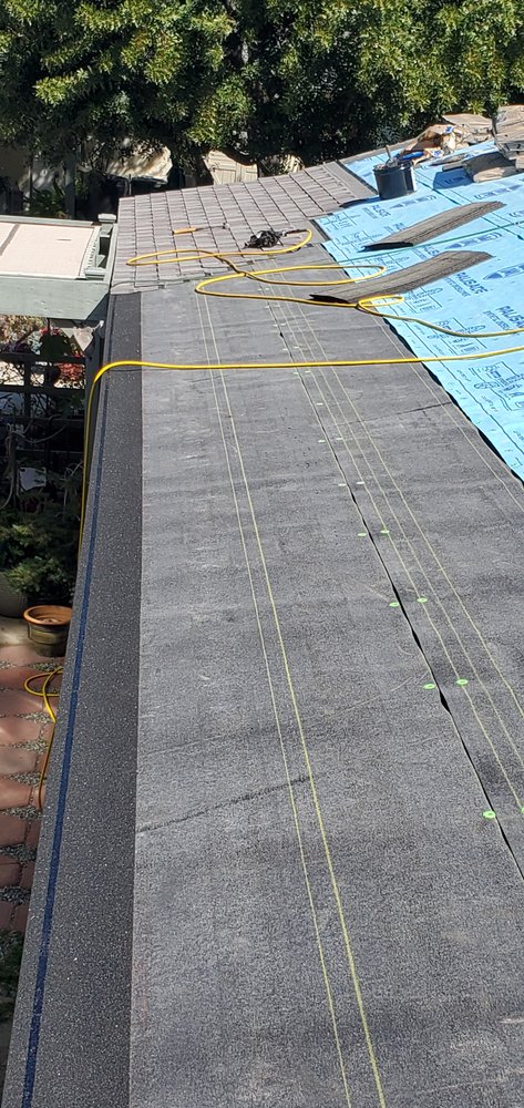 Slide of Three Clovers Roofing