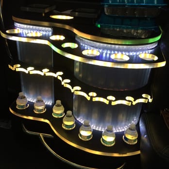 Culdesac Chauffeur Service - fancy time! well stocked with bottles of water, large bucket area filled with ice, and a trash can built in. - Limos Near Me