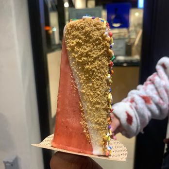 Yopop - a hand holding a cone of ice cream with sprinkles - Ice Cream & Frozen Yogurt Near Me - Pleasant Hill, California Yopop - a hand holding a cone of ice cream with sprinkles - Ice Cream & Frozen Yogurt Near Me - Pleasant Hill, California