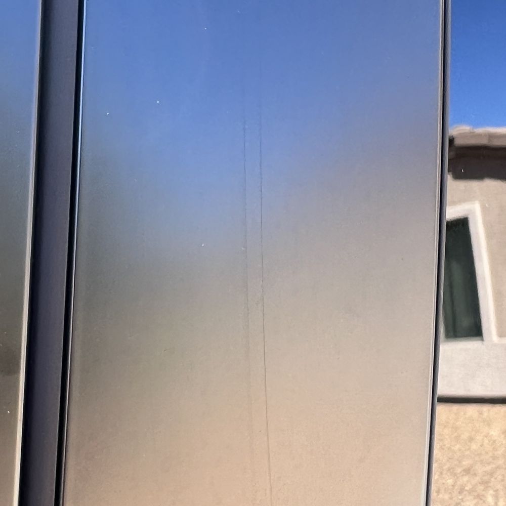 Flawless Glass Tinting - Scratch on the applique - Home Window Tinting Near Me - Kingman, Arizona Flawless Glass Tinting - Scratch on the applique - Home Window Tinting Near Me - Kingman, Arizona