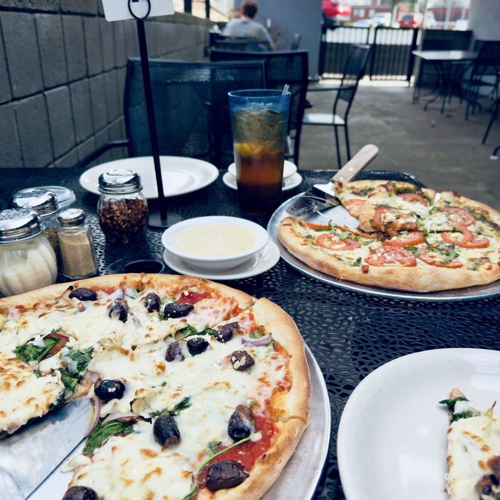 Savage Pizza - Nice day on the patio for a Greek and Fresca pizza with a side of garlic white sauce. - Pizza Near Me - Avondale Estates, Georgia Savage Pizza - Nice day on the patio for a Greek and Fresca pizza with a side of garlic white sauce. - Pizza Near Me - Avondale Estates, Georgia
