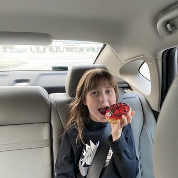 Gross Donuts - a little girl eating a donut - Donuts Near Me - Post Falls, Idaho Gross Donuts - a little girl eating a donut - Donuts Near Me - Post Falls, Idaho
