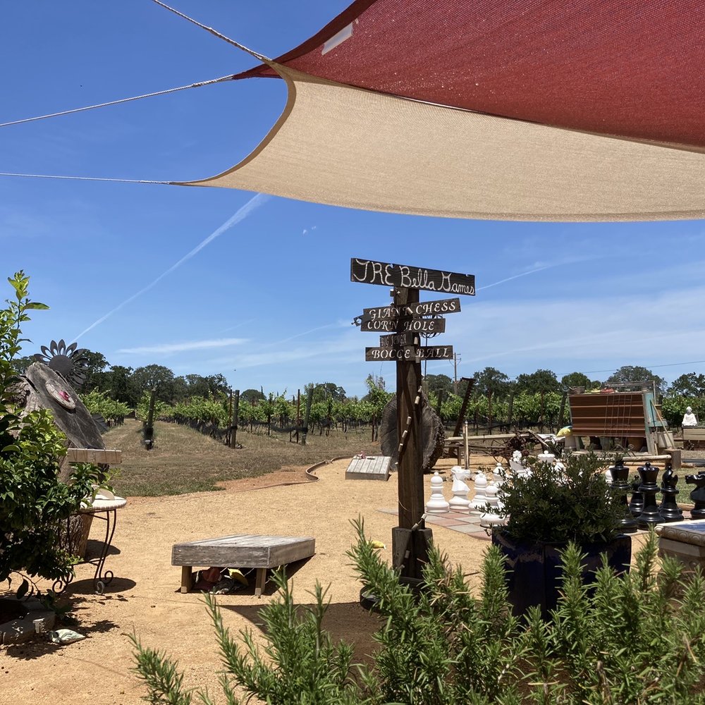 Tuscan Ridge Estate Winery - a sign post in the foreground - Wineries Near Me - Red Bluff, California Tuscan Ridge Estate Winery - a sign post in the foreground - Wineries Near Me - Red Bluff, California