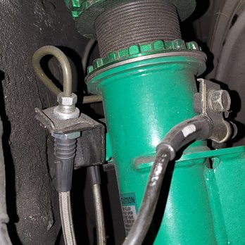 Action Auto - Left side front coilover.  Notice the space between the top and bottom rings. - Auto Repair Near Me - Cypress, California